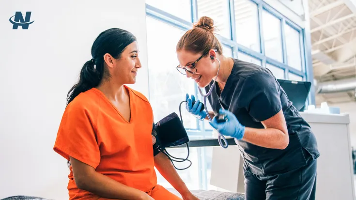 NaphCare Correctional RN Taking Vitals on a Patient at a Correctional Facility